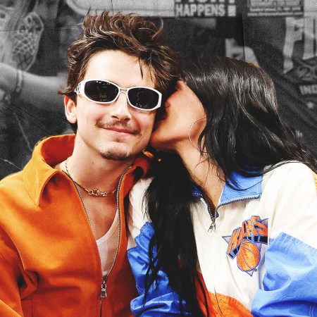 Timothee Chalamet getting a kiss on the cheek from Kylie Jenner at a New York Knicks game