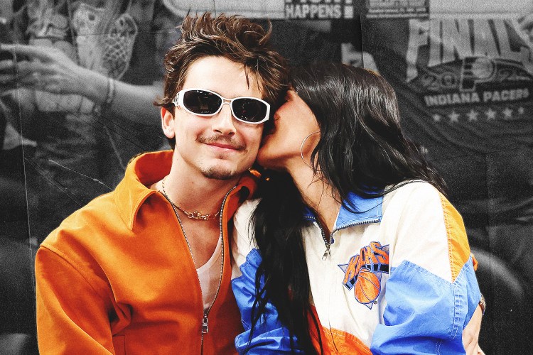 Timothee Chalamet getting a kiss on the cheek from Kylie Jenner at a New York Knicks game