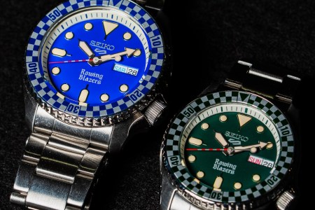 a close up of two Seiko x Rowing Blazers watches with blue and green dials on steel bracelets