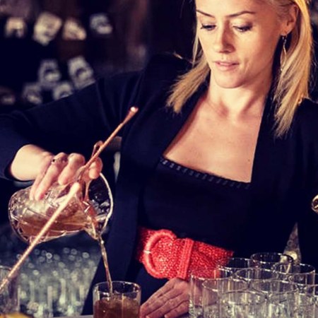 Tales of the Cocktail Executive Director Charlotte Voisey making a drink on a bar