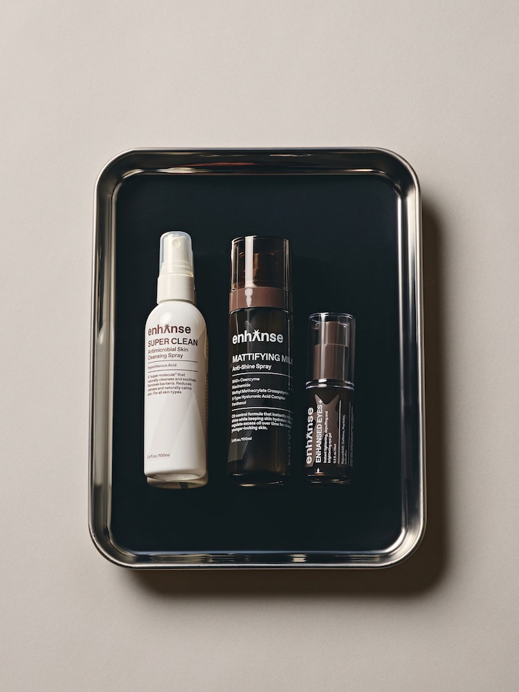 A silver tray with three Enhanse products lined up