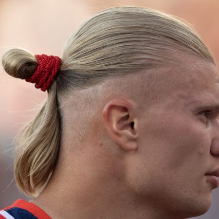 The profile of Norwegian soccer star Erling Haaland with a man bun