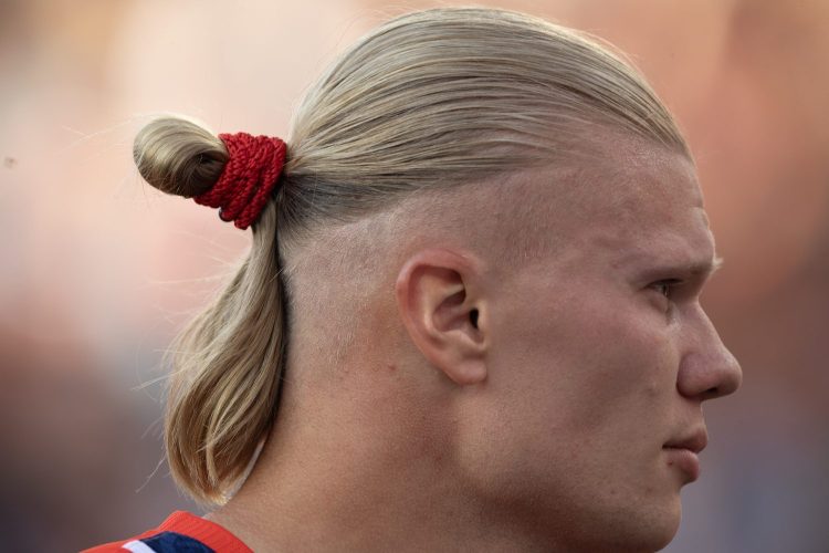 The profile of Norwegian soccer star Erling Haaland with a man bun