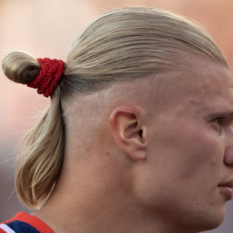 The profile of Norwegian soccer star Erling Haaland with a man bun