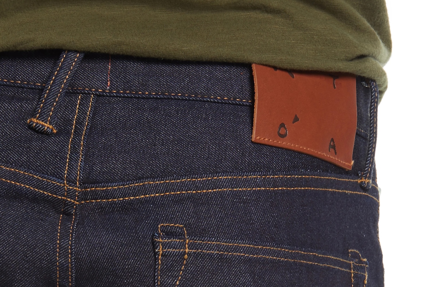 a close-up of selvedge blue jeans from behind