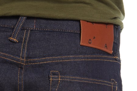 a close-up of selvedge blue jeans from behind