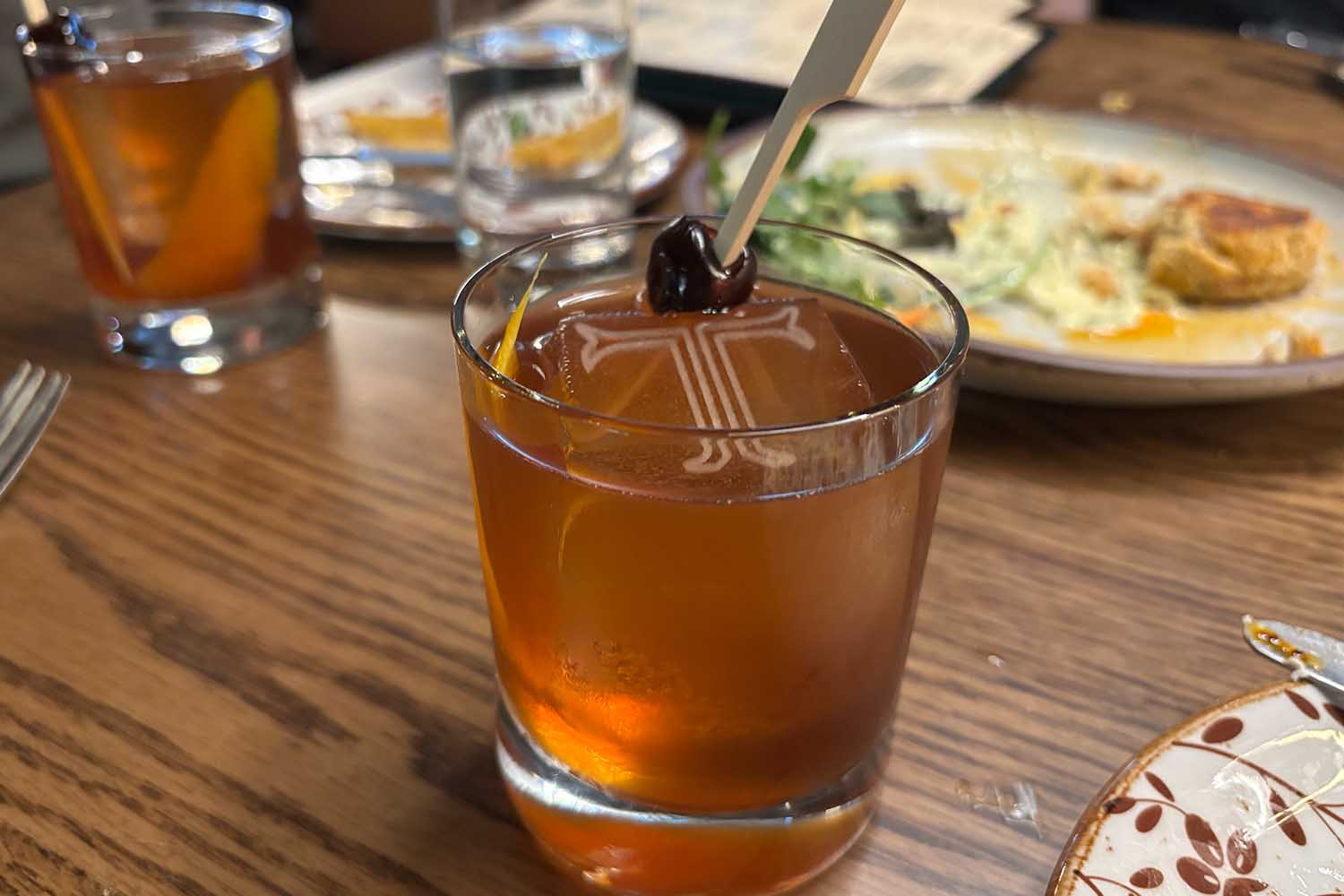 An Old Fashioned with a branded ice cube at The Trail Hotel