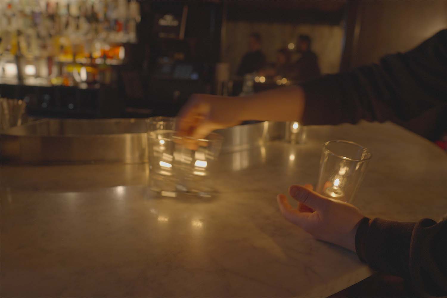 Placing candles at Death & Co.