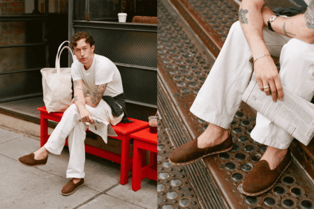 A man sitting with his suede slippers on a red bench.