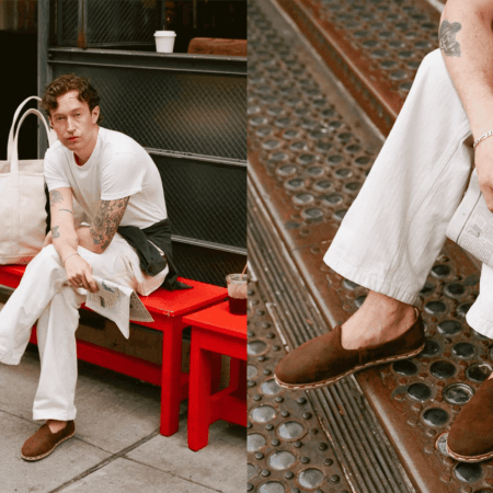 A man sitting with his suede slippers on a red bench.