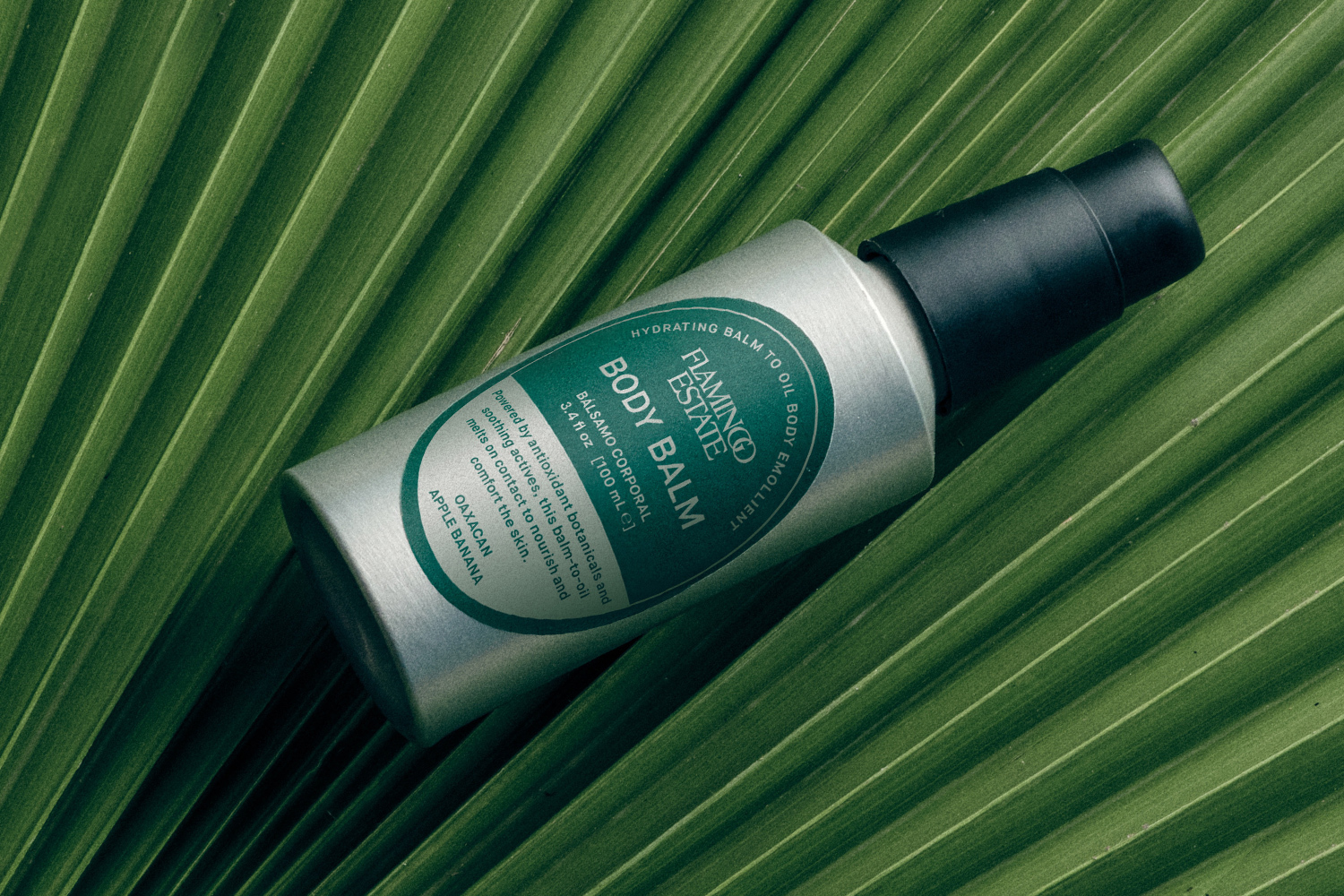 Bottle of Banana Balm on a leaf
