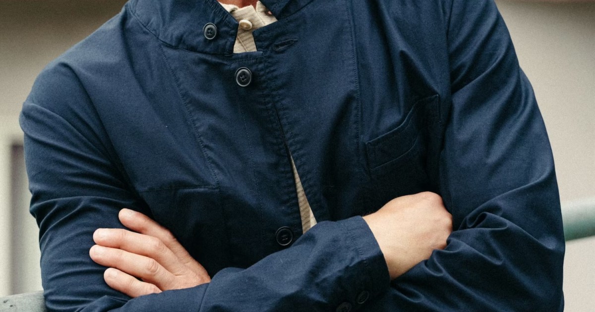 the body of a model wearing a navy jacket